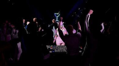 A naked DJ spinning records and teasing the crowd with her sexual moves, causing the audience to become extremely aroused.